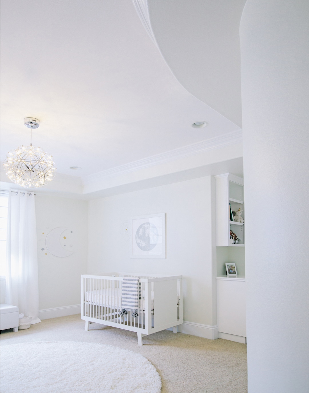 All White Celestial Nursery by Little Crown Interiors