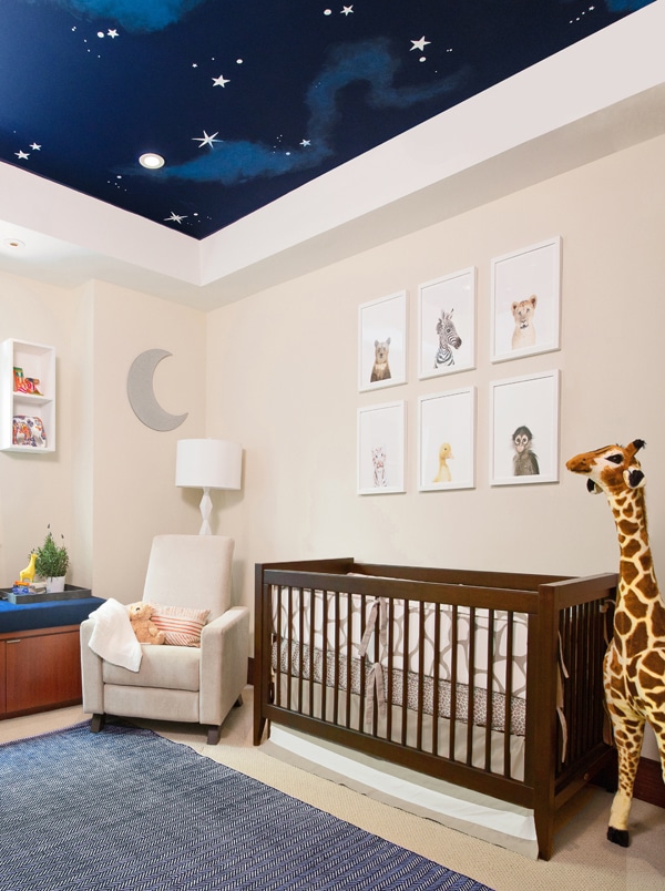 Neutral and blue nursery with night sky painted ceiling