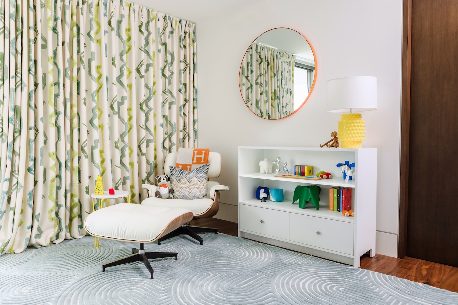 Colorful Modern Safari Nursery Design with Eames Lounger