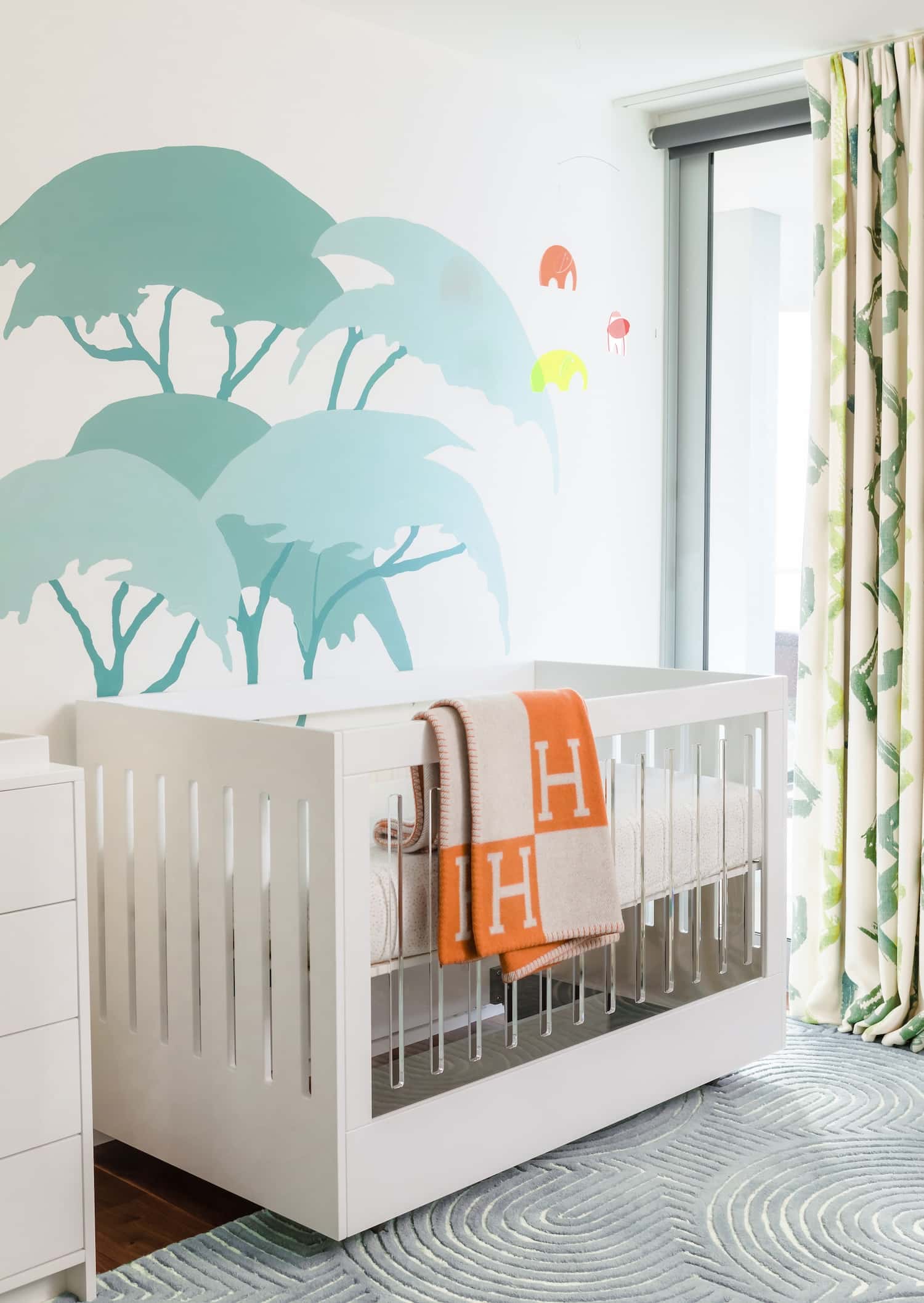 Colorful Modern Safari Nursery With Acrylic Crib