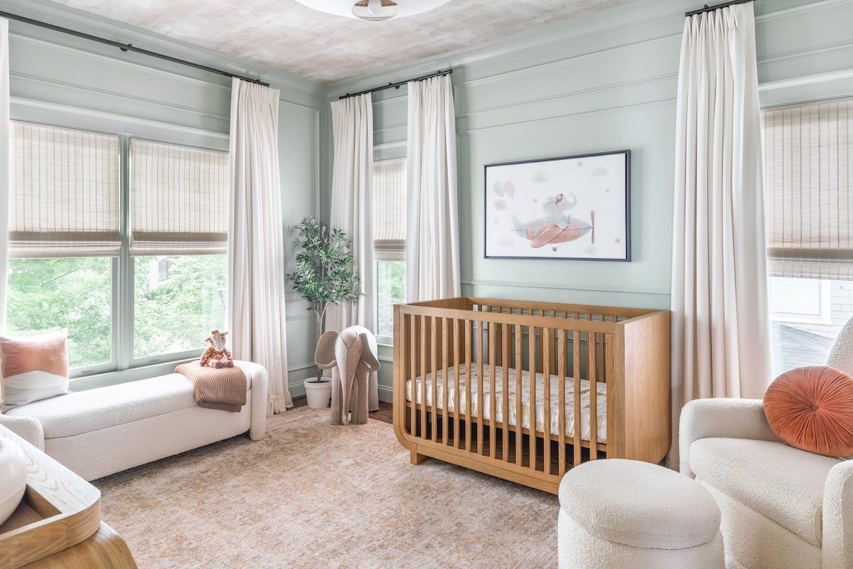 Sage Green Nursery Design with Paneling & Earth Tones